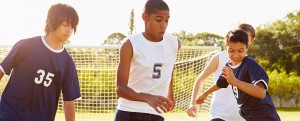 Teenage Boys Playing Football